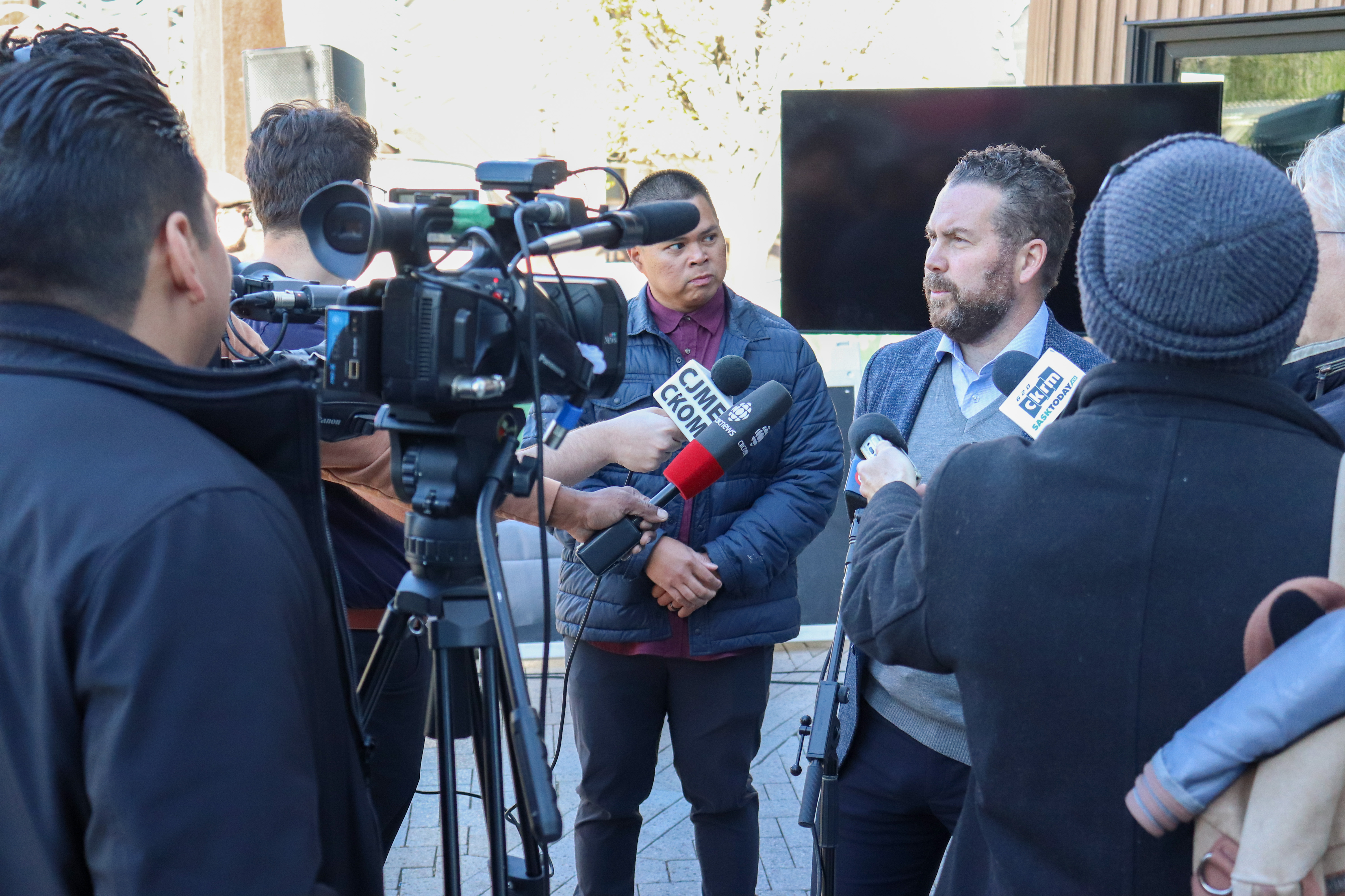 Kenric Exner, Vice President of Corporate Services at Harvard Developments,answers questions from the media at the PrairiesCan announcement press scrum.